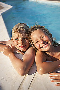 Similar – two little girls playing in the pool at the day time