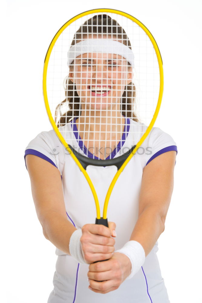 Similar – Face of a young woman hiding behind a featherball bat. Repeating the colour red. Sports grouch. Unsportsmanlike. Defense