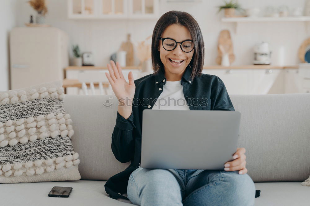 Image, Stock Photo afrcian woman on her cellphone while looking at laptop