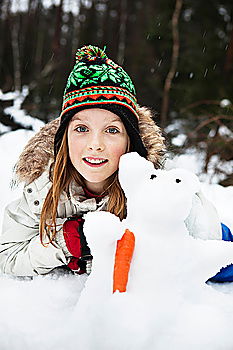 Similar – happy kid girl making snow man on Christmas