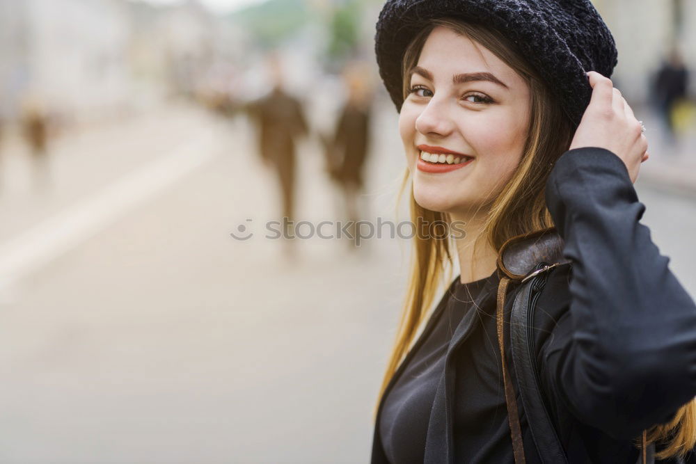 Similar – Young black woman drinking coffee wandering in the streets of Madrid on winter