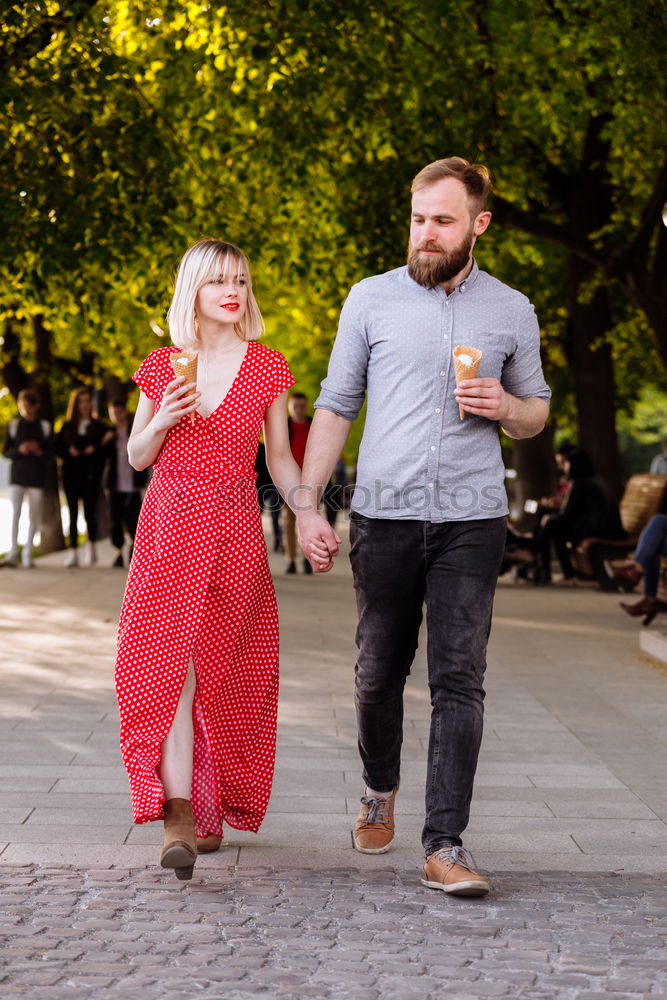 Similar – Image, Stock Photo Young smiling couple on a path in the park.