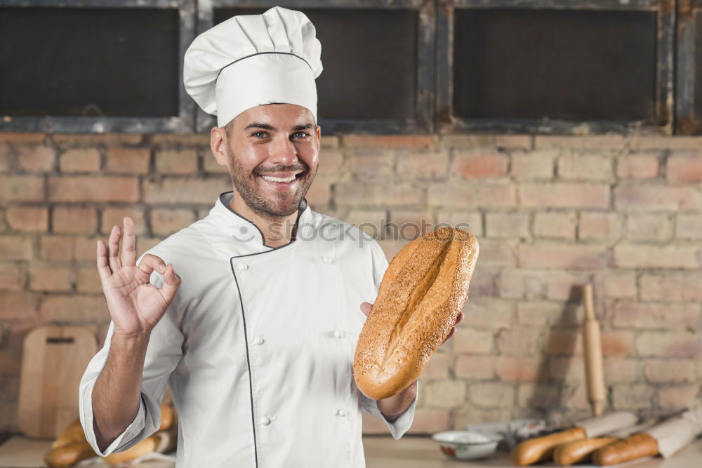 Similar – Image, Stock Photo male hands are holding brown baked rye bread