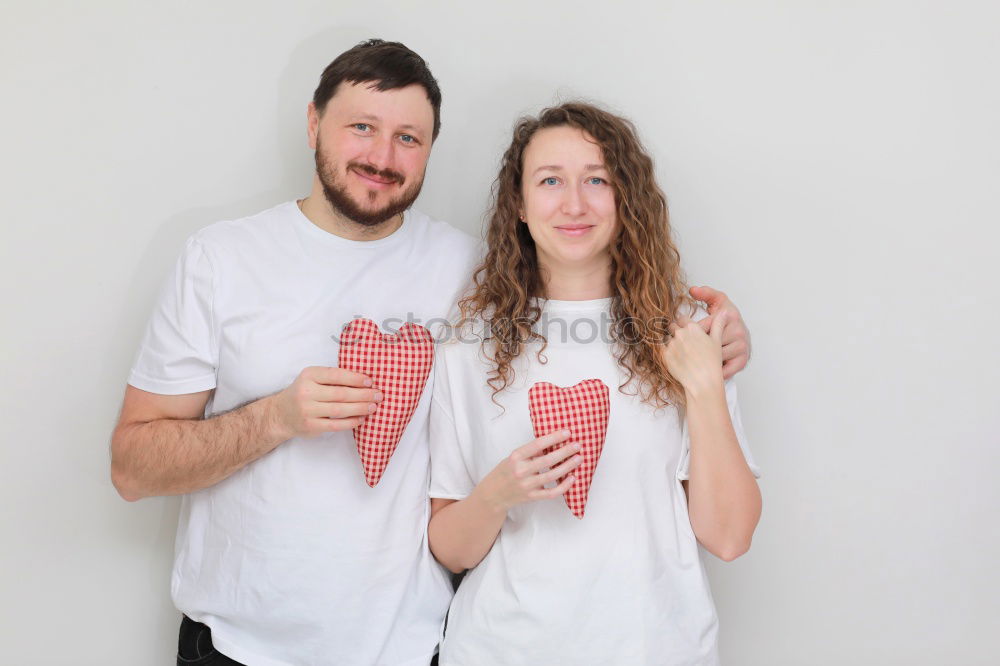 Similar – Image, Stock Photo Beautiful young couple hugging, looking at camera and smiling