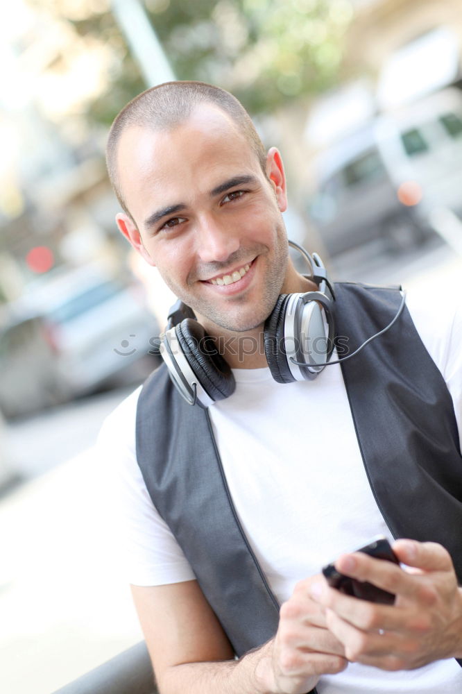 Similar – Image, Stock Photo Young man waiting listening music and using mobile phone at the airport with a suitcase.