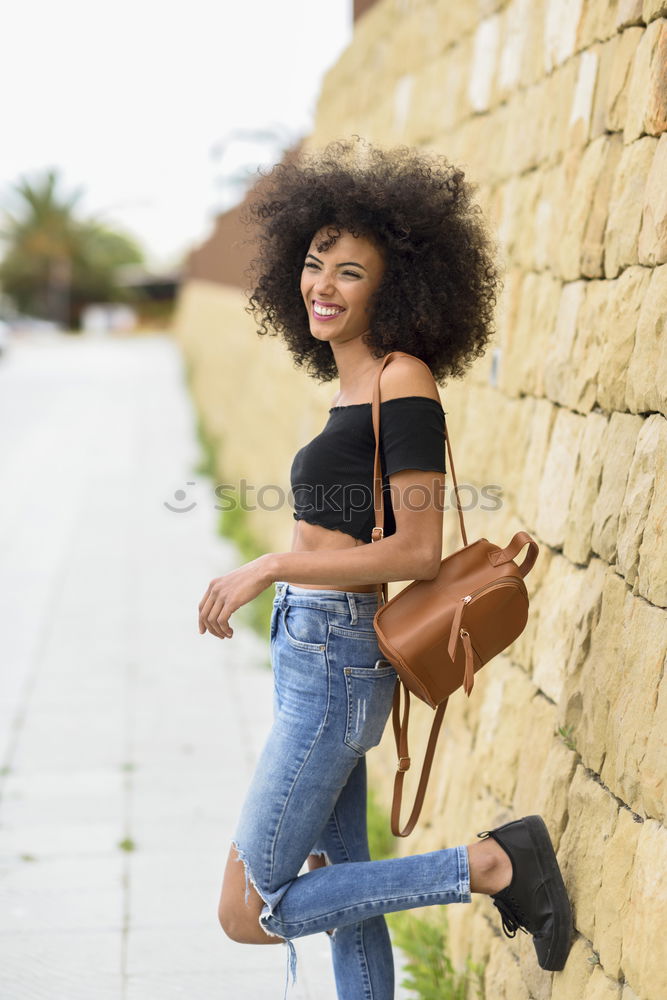 Similar – Image, Stock Photo Happy mixed woman with afro hair laughing outdoors.