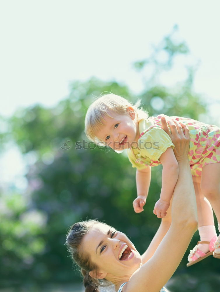 Similar – Teenage girl with her little sister spending time together in the swimming pool in a garden enjoy eating ice cream on a summer sunny day. Family quality time