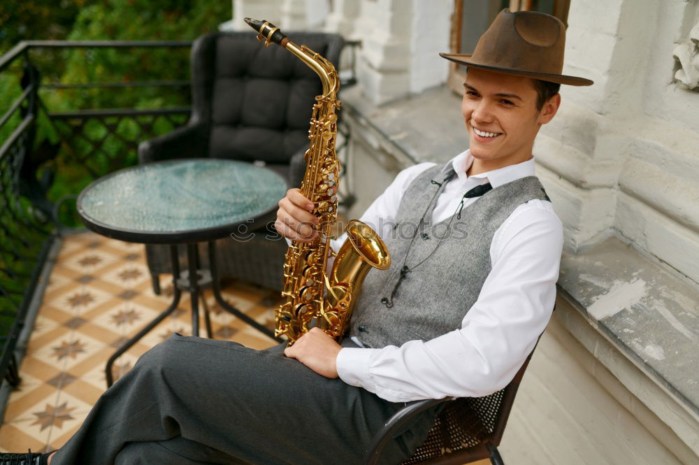 Similar – Image, Stock Photo Smiling jazzman with sax