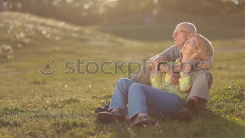 Similar – Woman with child on lawn