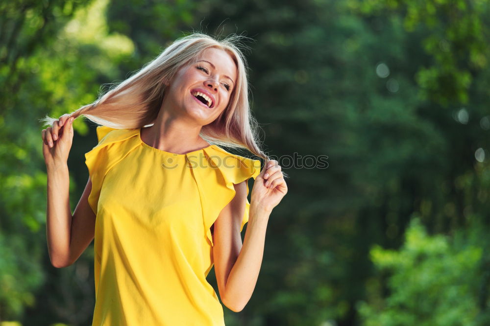 Similar – Young woman with moving hair wearing casual clothes