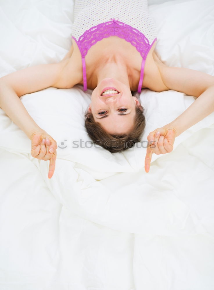 Similar – Image, Stock Photo Young girl looking at mobile phone while sitting on bed