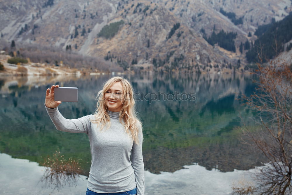 Similar – Smiling woman at lake