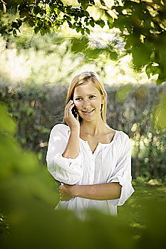 Similar – sad young woman leaning against tree