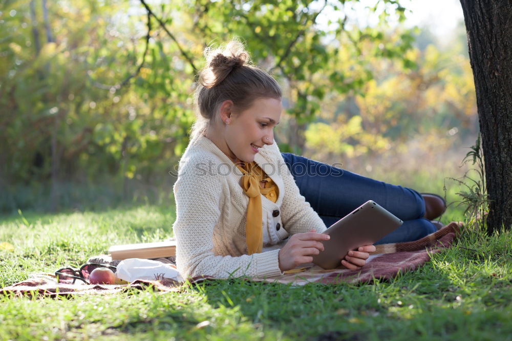 Similar – Image, Stock Photo Girl siting under the tree, reading the book