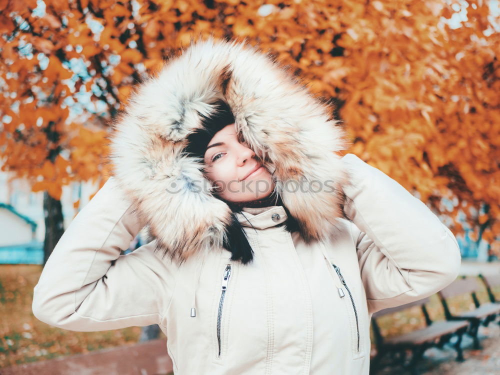 Similar – Image, Stock Photo Young woman with glasses and red rain jacket at the sea