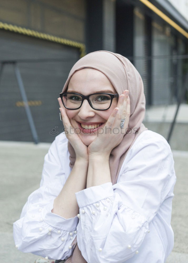 Similar – Smiling young woman wearing hijab outdoors