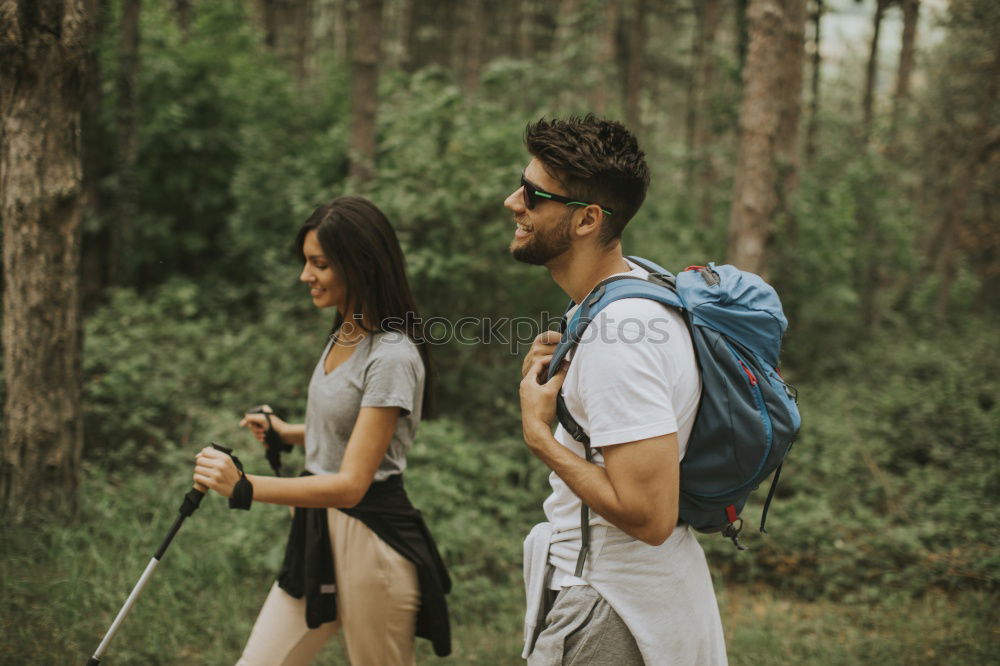 Similar – Couple of hikers doing trekking