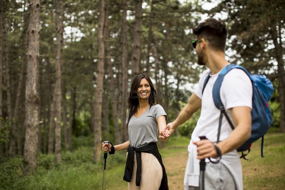 Similar – Couple of hikers doing trekking