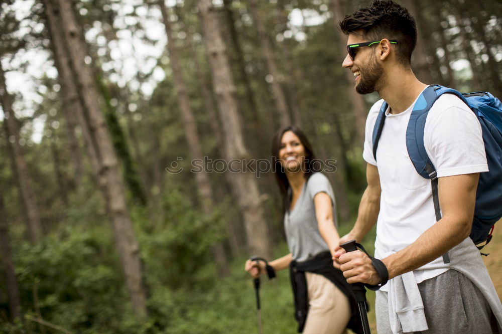 Similar – Couple of hikers doing trekking