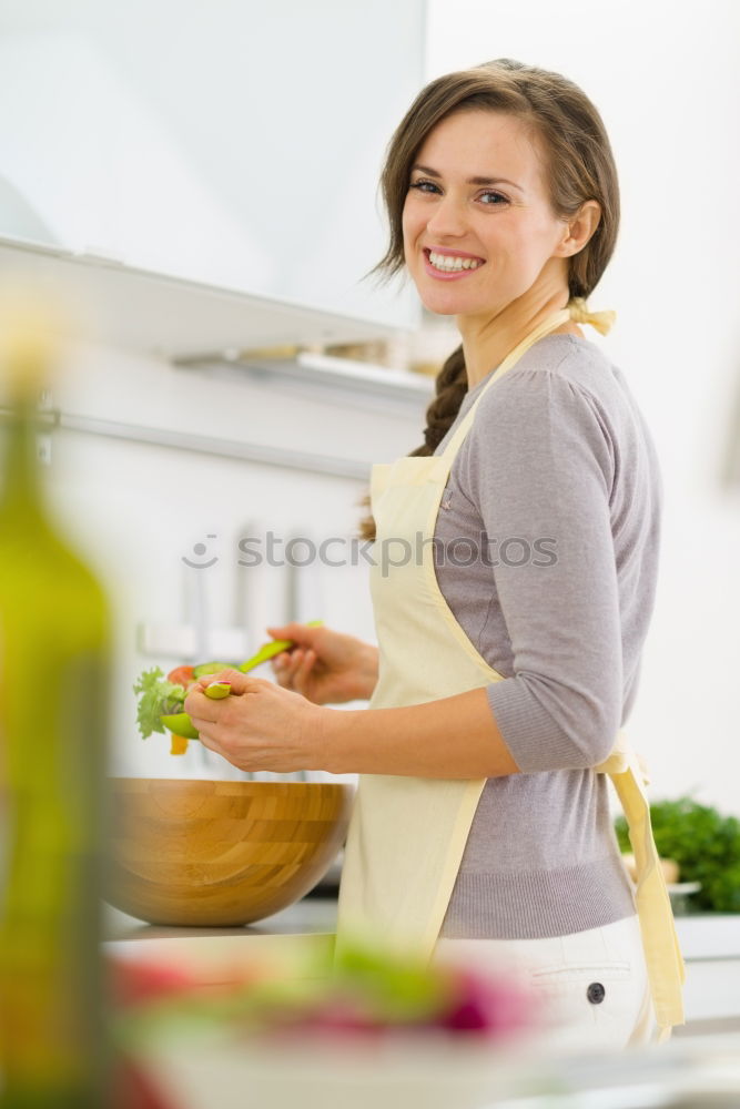 Similar – Young couple cooking. Man and woman in their kitchen