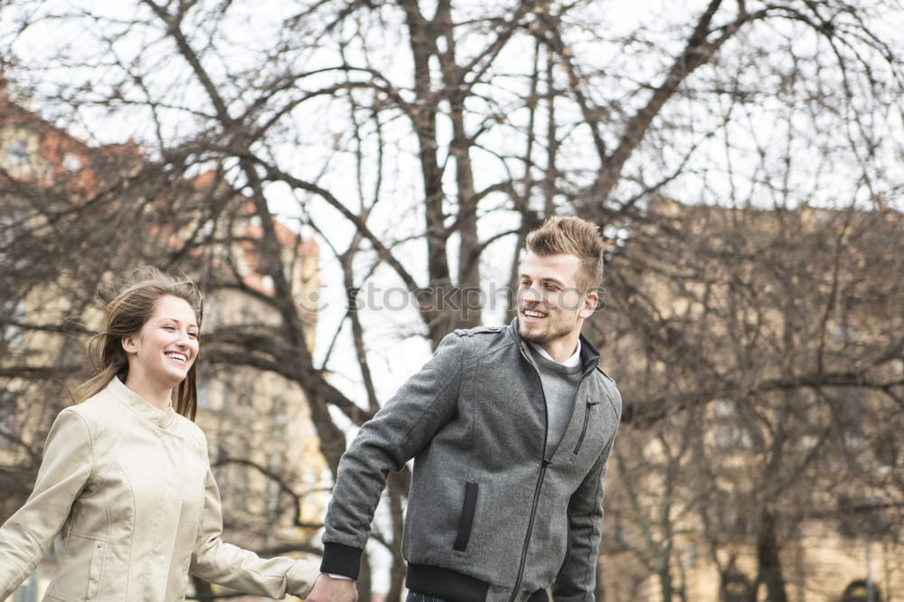 Similar – Image, Stock Photo Happy couple looking each other and laughing outdoors