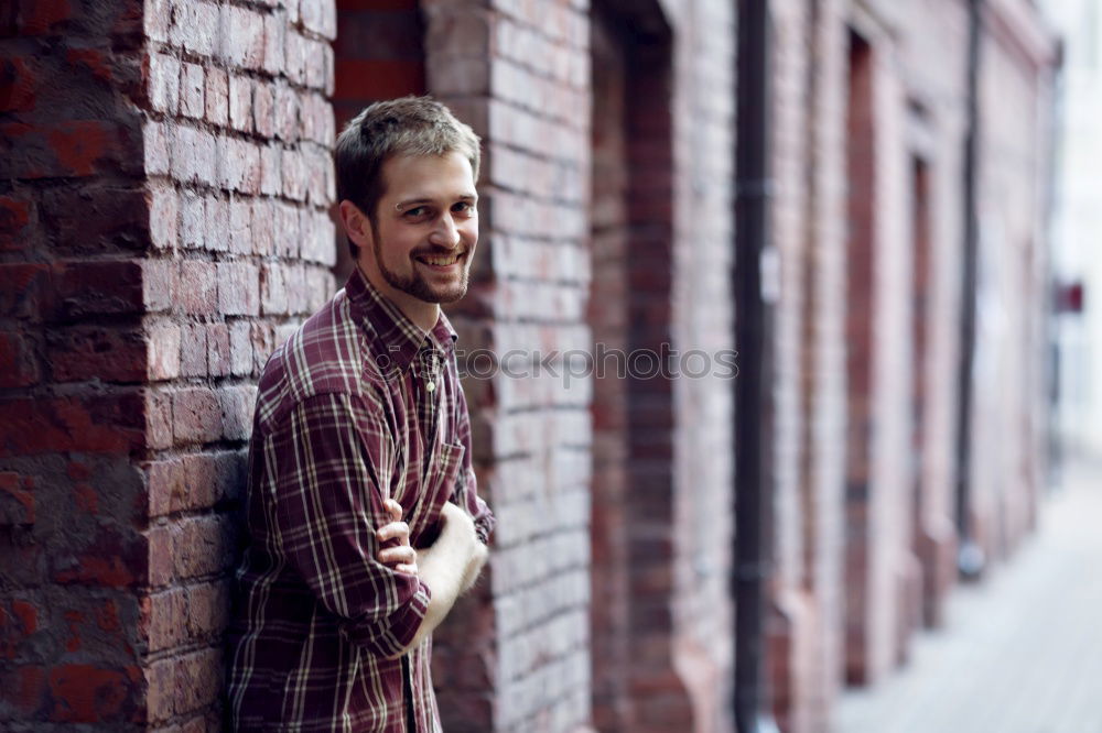 Similar – Man sitting in a bench on a beautiful maroon background