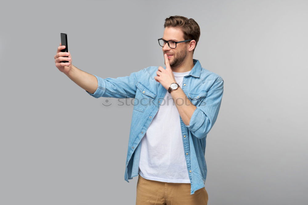 Similar – Man using his mobile phone.