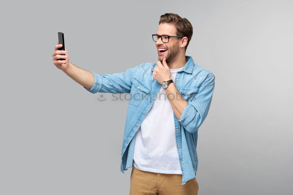 Similar – Man using his mobile phone.