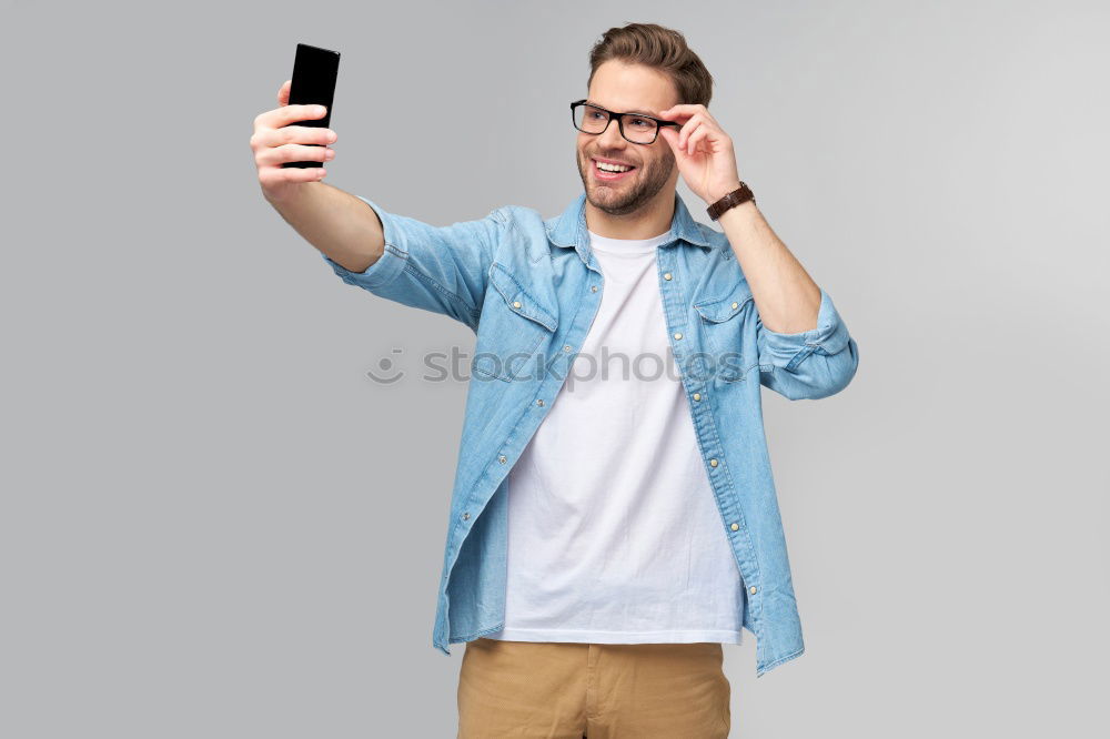 Similar – Man using his mobile phone.