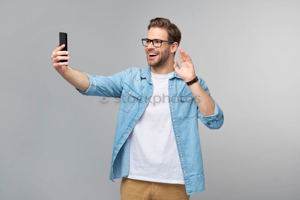 Similar – Man using his mobile phone.