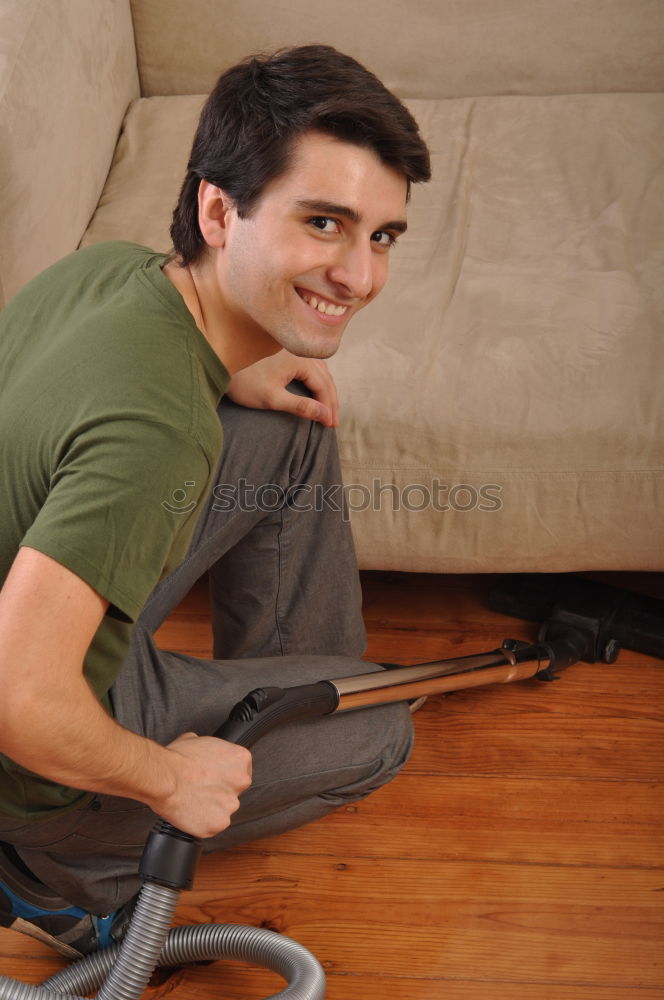 Similar – Relaxed boy holding smartphone sitting in chair at home