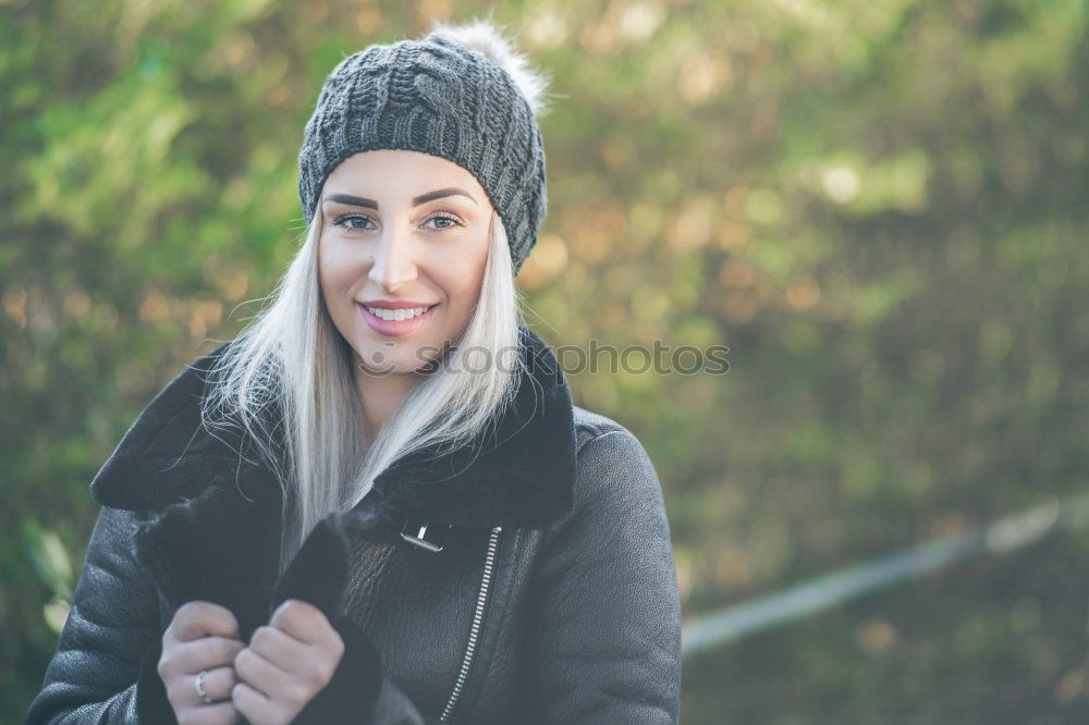 Similar – Happy young blond woman standing on urban background