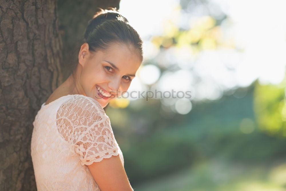 Similar – Young black woman with afro hairstyle smiling in urban park