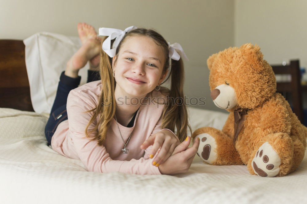 Similar – happy little child girl lying on her bed in the morning