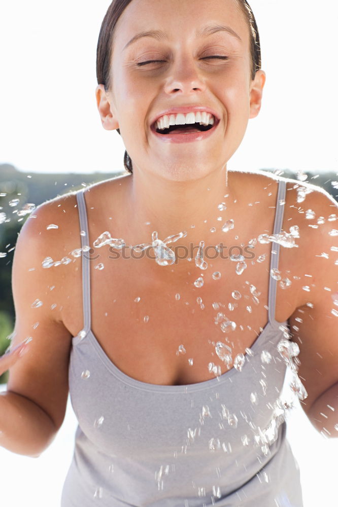 Similar – Fit sporty woman drinking water from a bottle