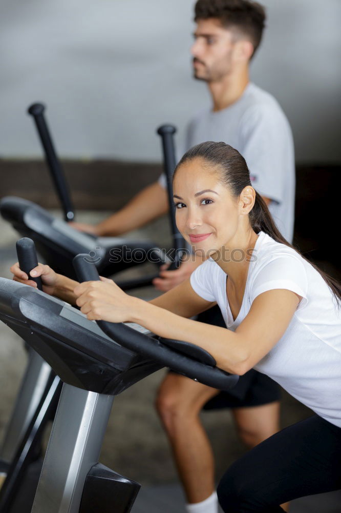 Similar – Image, Stock Photo Couple in a spinning class wearing sportswear.