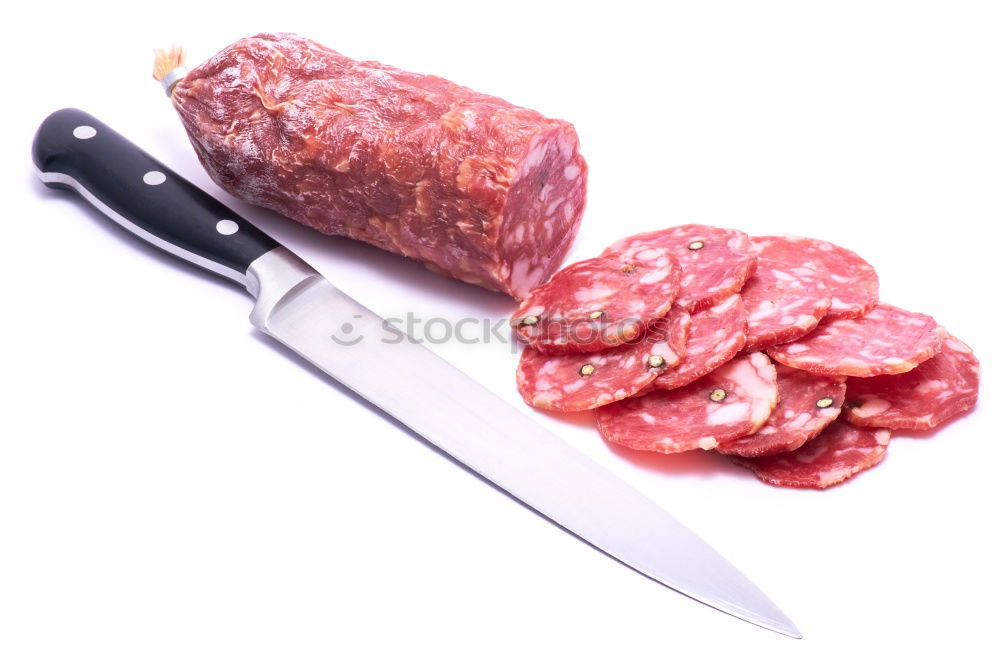 Foto Bild Schweinefilet Stücke mit Fleischmesser