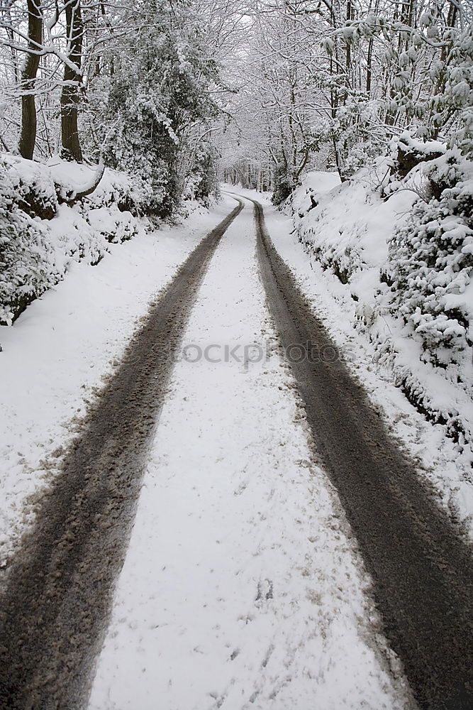 Similar – Snowy rural road at winter