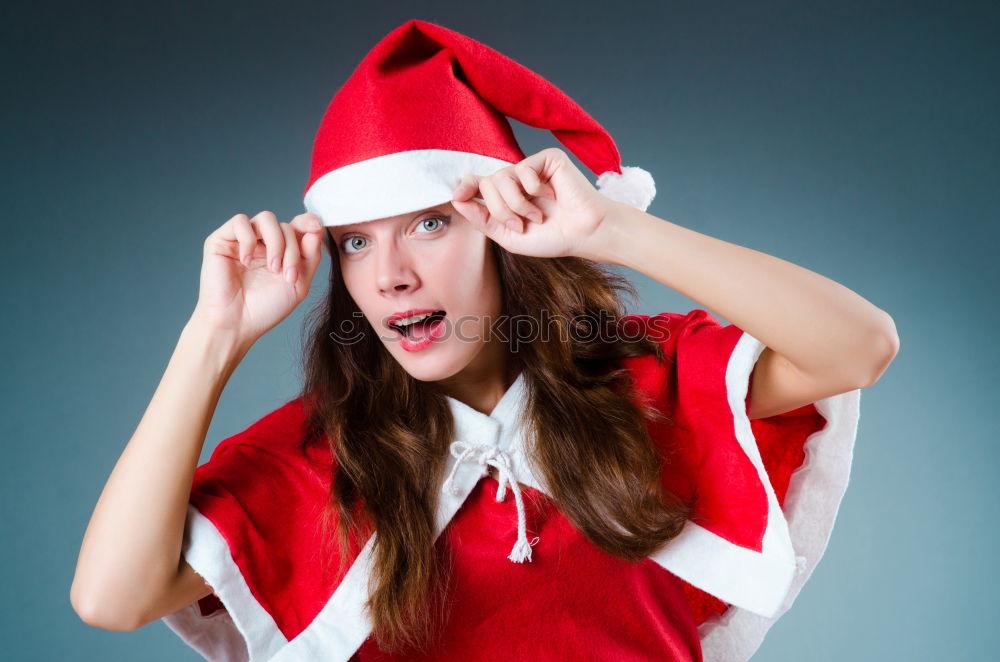 Similar – Image, Stock Photo Young woman with Christmas hat in the forest