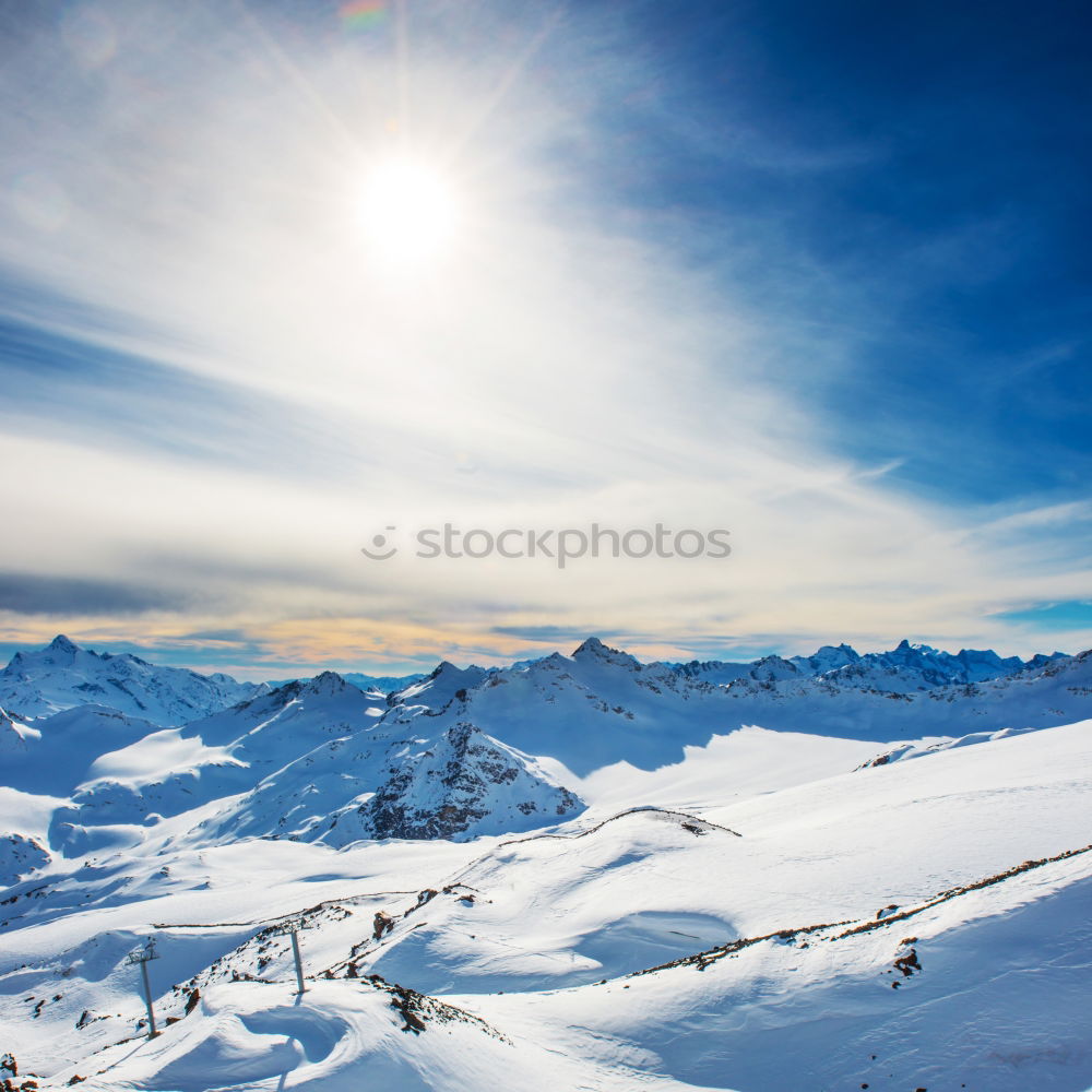 Similar – Image, Stock Photo Snowy blue mountains in clouds at sunset