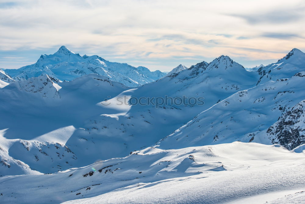 Image, Stock Photo Snowy blue mountains in clouds at sunset