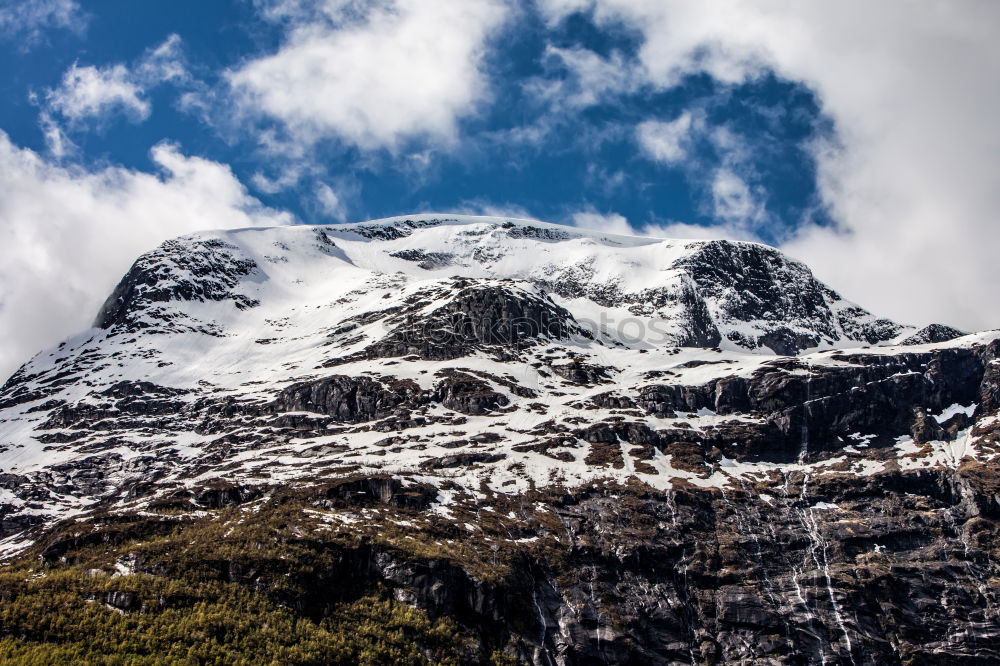 Similar – Man walking in snowy mountains