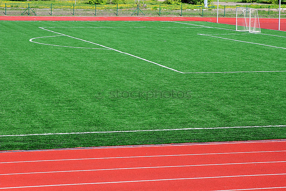 Similar – a green empty soccer field from above