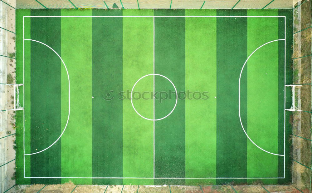 Similar – a green empty soccer field from above