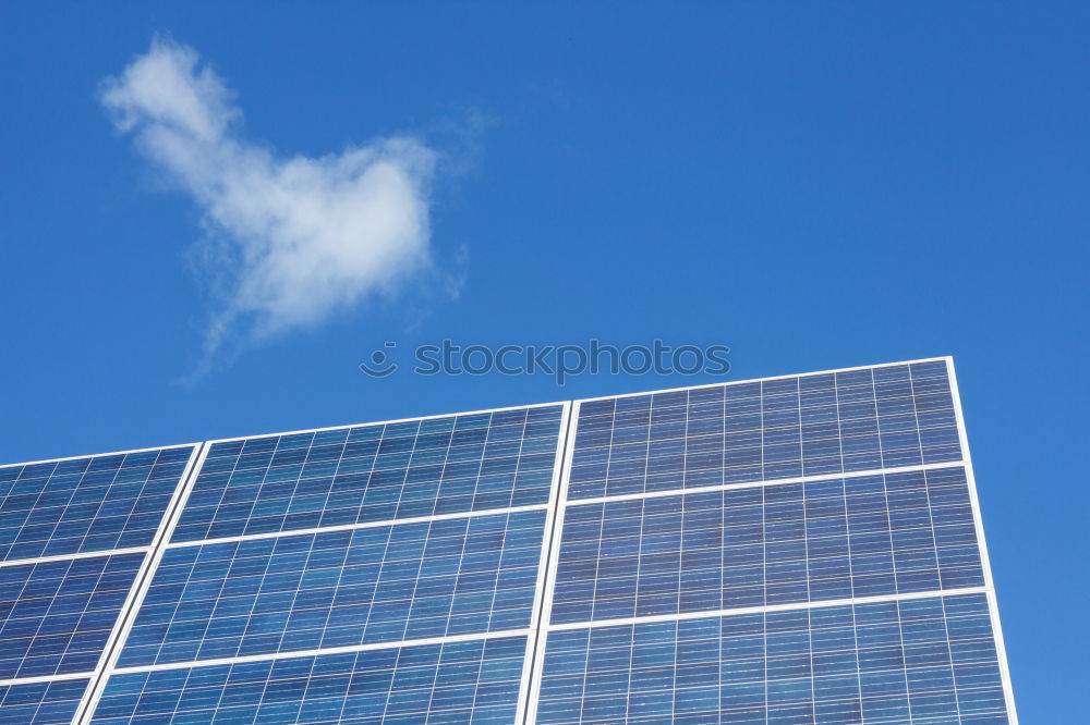 Similar – Photovoltaic panels in a solar power plant over a blue sky.