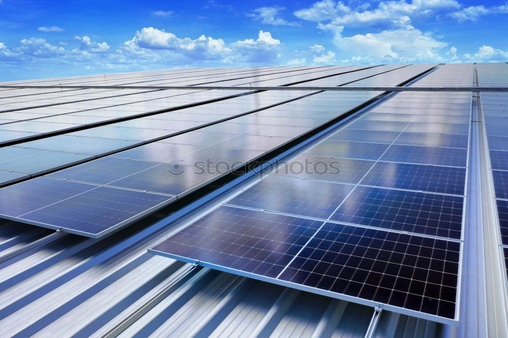 Similar – Photovoltaic panels in a solar power plant over a blue sky.