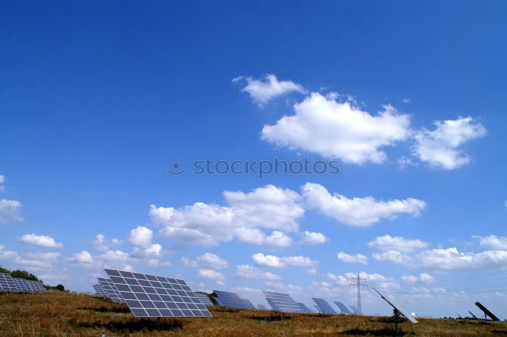 Similar – Photovoltaic panels in a solar power plant over a blue sky.