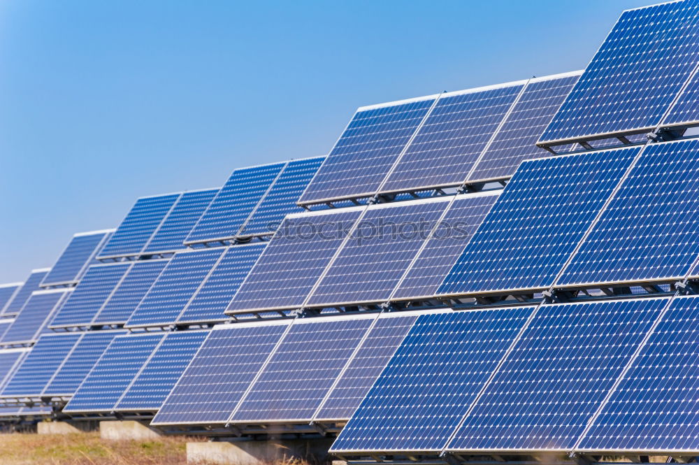 Similar – Image, Stock Photo An area of many photovoltaic panels. Solar power plant on an industrial roof , many solar panels , photovoltaics