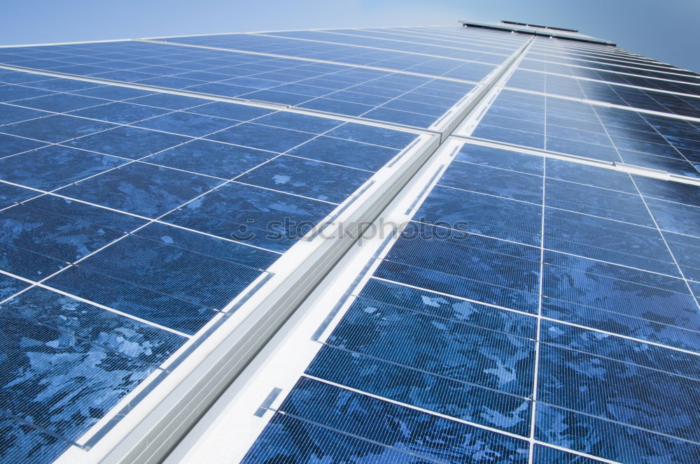 Similar – Photovoltaic panels in a solar power plant over a blue sky.