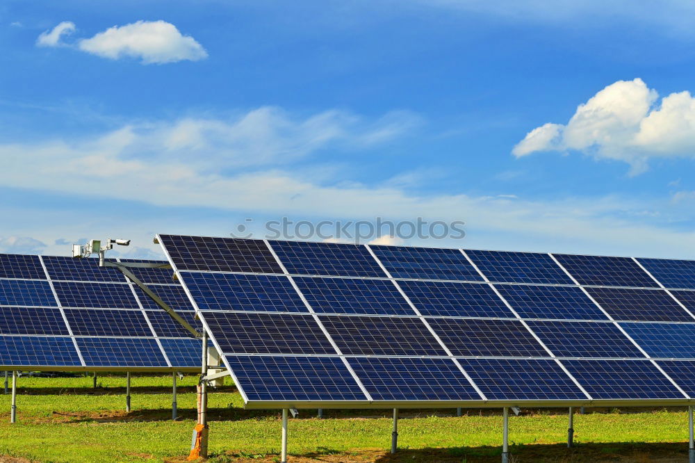 Similar – Image, Stock Photo An area of many photovoltaic panels. Solar power plant on an industrial roof , many solar panels , photovoltaics